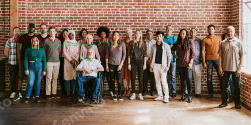 Preview: Group of diverse people standing in front of a brick wall