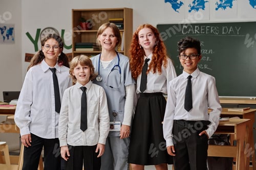 Preview: Female Doctor And Group Of Students Portrait