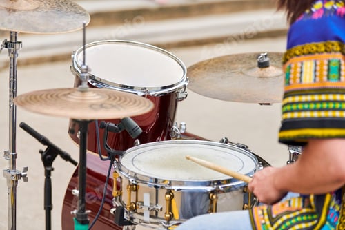 Preview: Drummer man playing drums percussion with sticks, drum kit on concert stage, drumsticks and drums