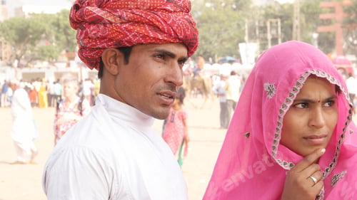 Preview: Closeup of an Indian couple in traditional outfits outdoors.