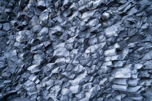 Preview: Basalt stones as a background. Image for background and wallpaper. Sharp rocks.