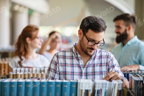 Preview: Education campus friendship people concept. Group of happy students studying together in library