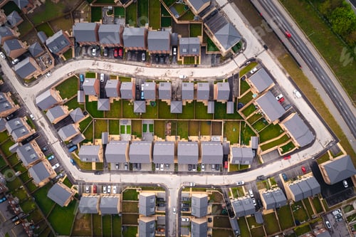Preview: Aerial view directly above a new build housing estate in the UK