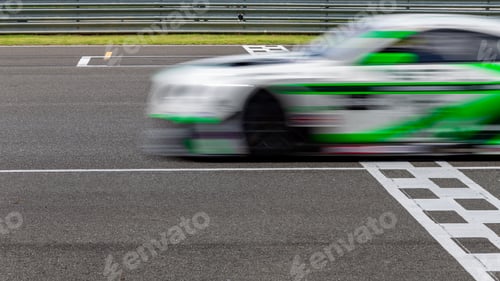 Preview: Race car blurred motion crossing the finish line on international circuit speed track, Motion blur.