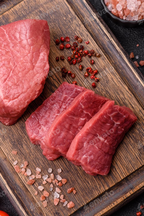Preview: Raw beef tenderloin ribeye steak with salt and spices