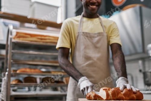 Preview: Baker Cutting Bread with Poppy Seeds