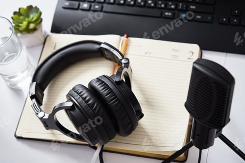 Preview: Microphone and headphones on the table, top view. Radio podcast workplace