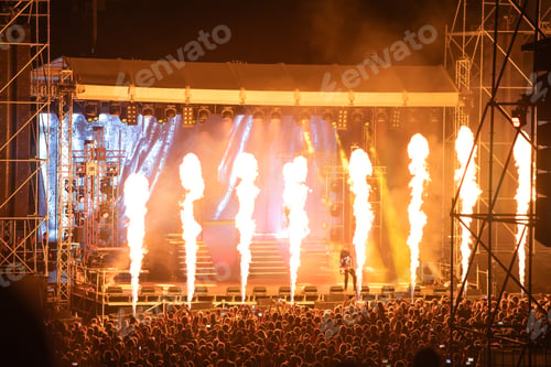 Preview: Crowd at concert and blurred stage lights.
