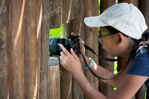 Preview: Young photographer with digital camera