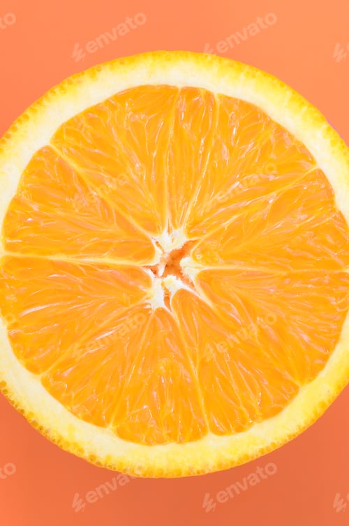 Preview: Top view of a one orange fruit slice on bright background in orange color