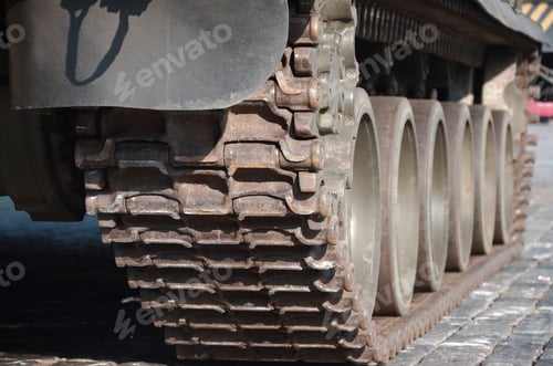 Preview: Close up of green armoured caterpillar transport. Modern militar
