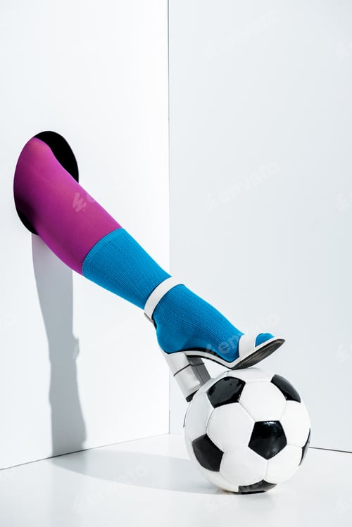 Preview: cropped image of girl putting leg in stylish violet tights, blue sock and white high heel on