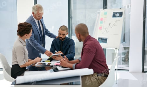 Preview: Giving his expert opinion. Shot of businesspeople working in an office.