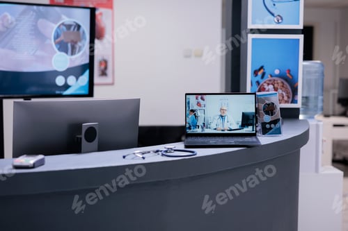 Preview: General practitioner attending patients through computer