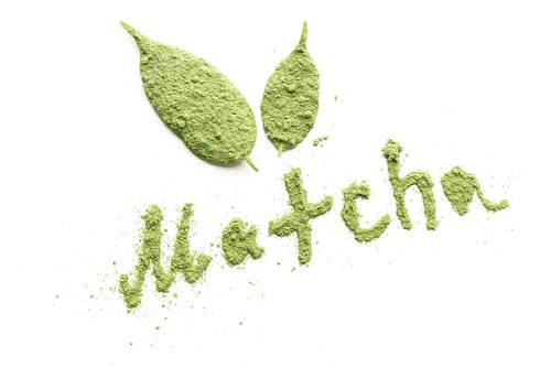 Preview: Matcha tea powder in the form of an inscription on a white background. Top view.