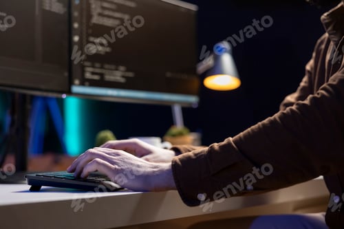 Preview: Computer scientist typing on keyboard, testing and debugging code, close up