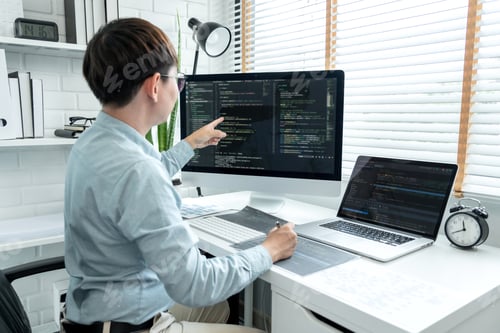 Preview: Male programmer is programing to developing program app and website of corporate while working