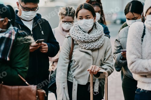 Preview: Shot of a group of young people wearing masks while travelling in a foreign city