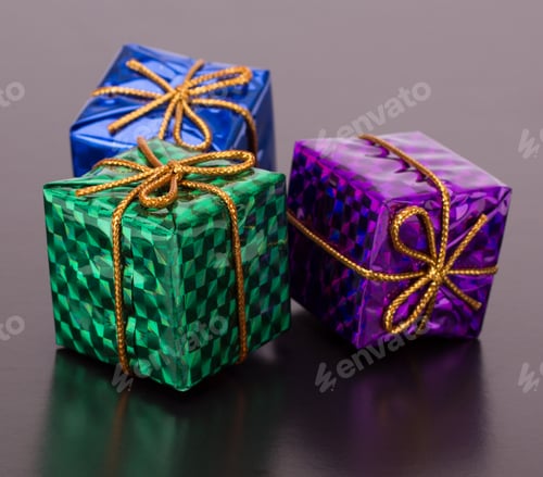 Preview: Christmas decorative gift boxes, drums and balls isolated on black background