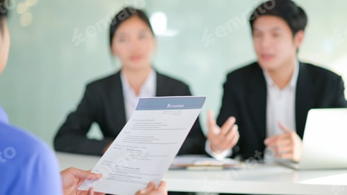 Preview: Interviewing job seekers presenting their resume for executives to consider.