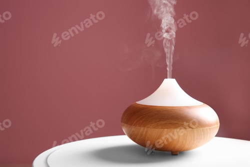 Preview: Aroma oil diffuser on table against color background