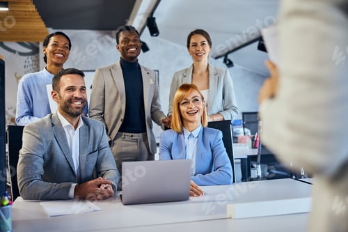 Preview: Smiling businesspeople standing and sitting in the office, listening to their female boss.