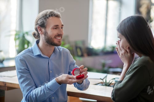 Preview: Man Proposing Marriage to Happy Woman at Home