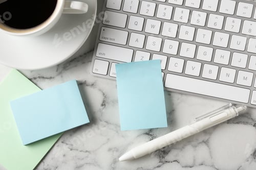 Preview: Blank notes, keyboard, pen and cup of coffee on white marble table, flat lay. Space for text