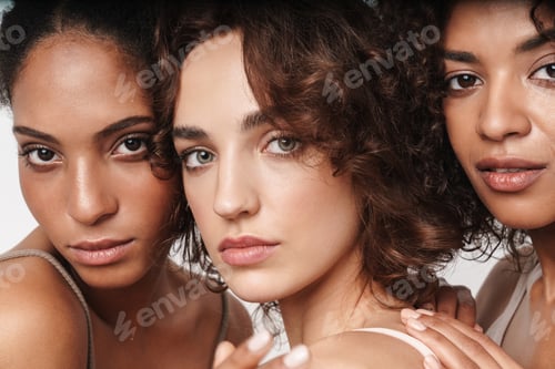 Preview: Close up beauty portrait of three attractive young sensual multiethnic women