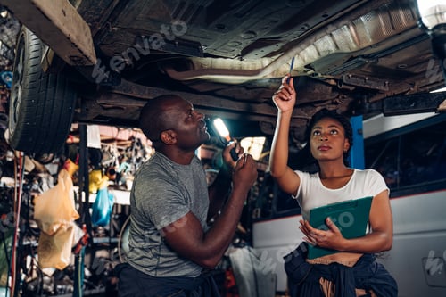 Preview: Team Auto mechanic are checking auto engine is problems at car repair shop.