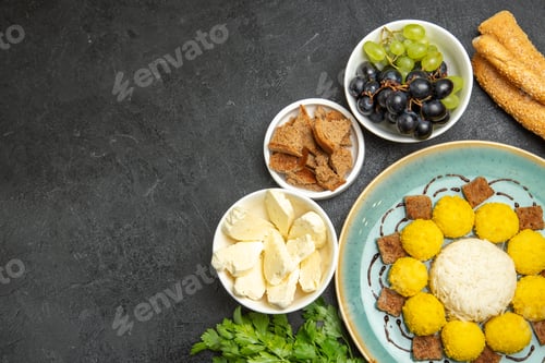 Preview: top view sweet yummy candies with white cheese and grapes on dark background fruits candy tea sweet