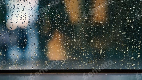 Preview: Window and rain drop in condominium or apartment room on a rainy day