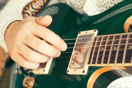 Preview: man playing electric guitar