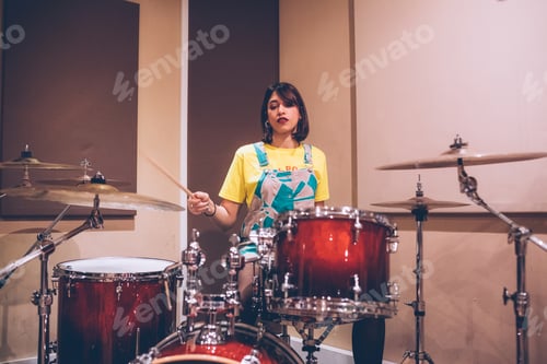 Preview: Woman Playing Drums in a Recording Studio