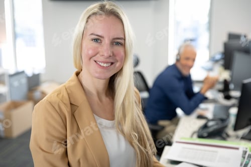 Preview: Portrait of businesswoman smiling at modern office
