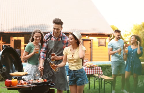 Preview: Group of friends having fun at barbecue party outdoors