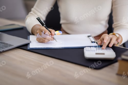Preview: Financial Businesswomen analyze the graph of the company's performance to create profits and growth,