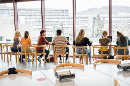 Preview: Group of students studying in front of the window of the university library