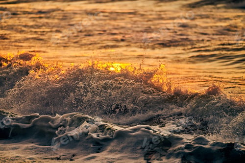 Preview: Atmospheric sea foam at colorful sunset, breathtaking scene of deep sea waves in gold water sparkles