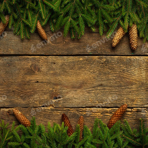 Preview: Christmas tree branches with cones on wooden texture ready for y