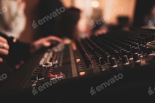 Preview: Audio Mixing Console in Dimly Lit Recording Studio