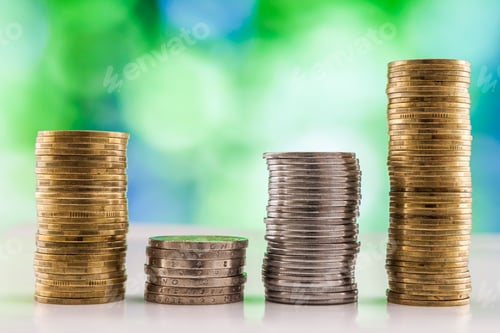 Preview: Growing coins stacks with green and blue sparkling bokeh background.
