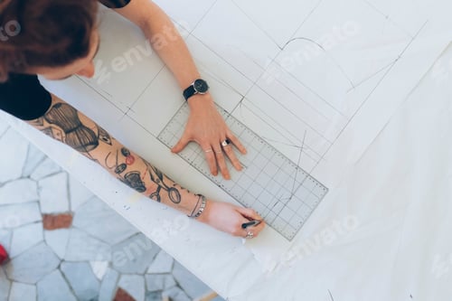 Preview: Fashion designer drawing and creating dressmaker's pattern