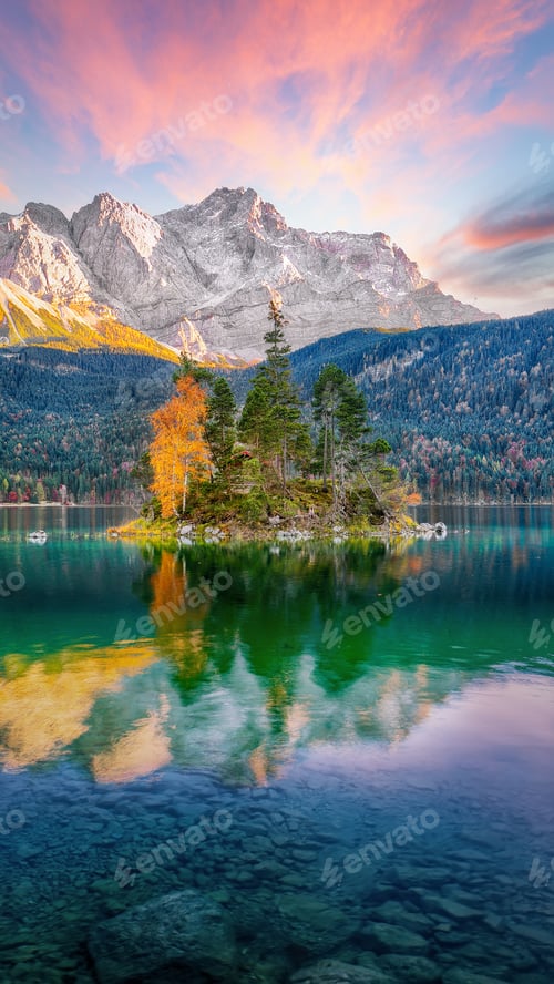Preview: Astonishing autumn landscape of Eibsee Lake in front of Zugspitze summit under sunset