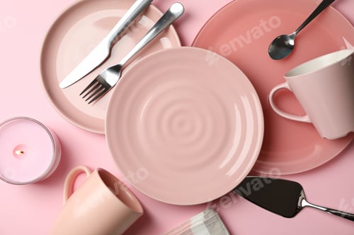 Preview: Tableware and cutlery on pink background, top view