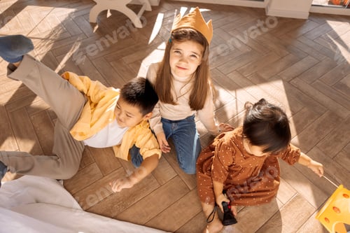 Preview: are messing around in the bedroom on the floor. Small children have fun in the living room
