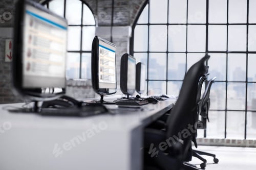 Preview: Row of desktop computers at call centre workstation