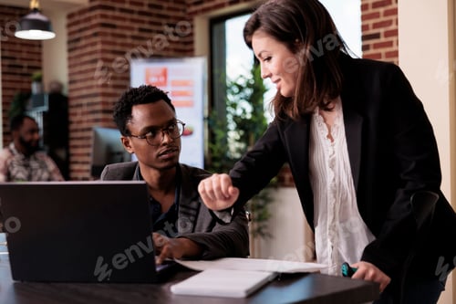 Preview: African american paralyzed man and young woman doing teamwork