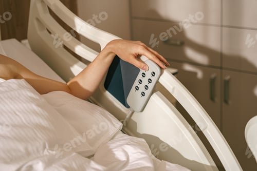 Preview: Close up of woman patient hand presses the buttons on the hospital bed