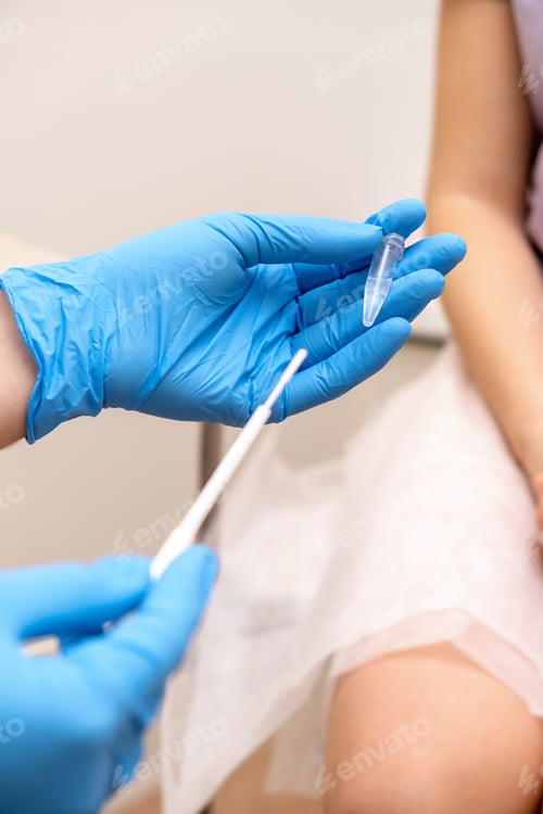 Preview: The gynecologist examines the patient, takes a sample of the biomaterial in an Eppendorf test tube.
